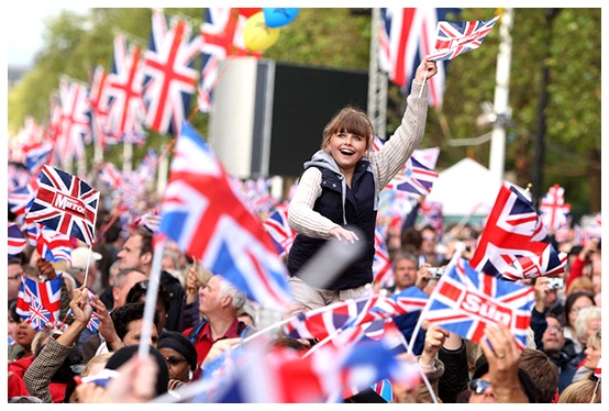 British English slang words and phrases young English girl on top of shoulders in parade celebrating
