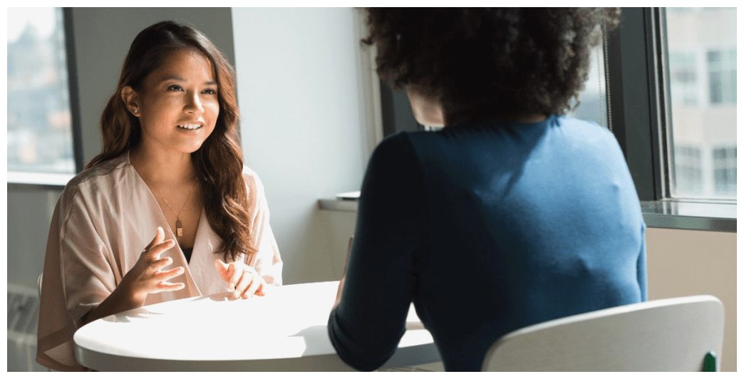 Two women having a conversation in English