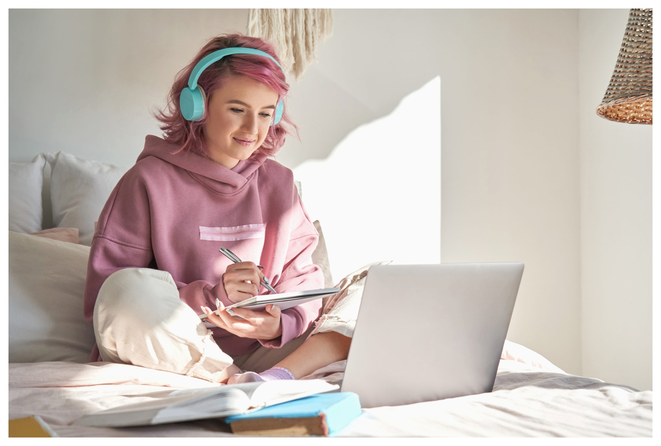 girl writing down notes in a notebook