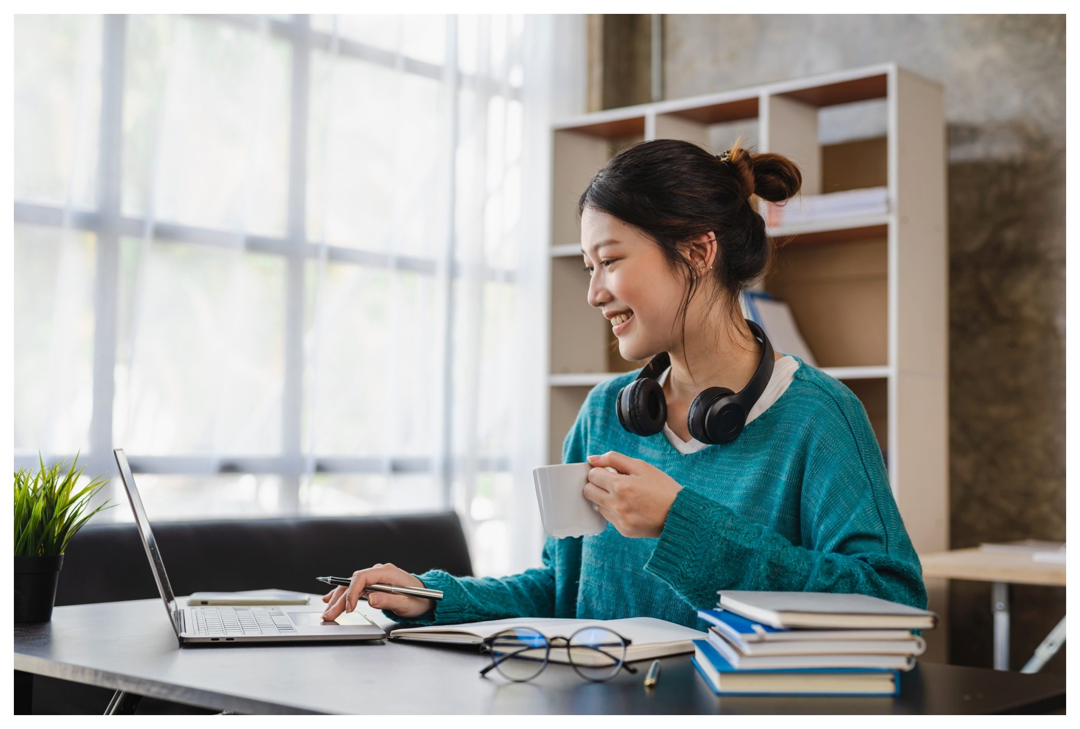 Girl working and sipping coffee