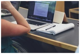 Woman with laptop studying